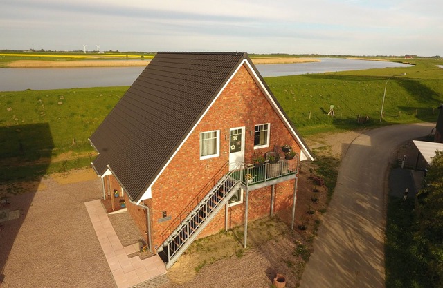 Casa de vacaciones Hemmerdeich EG Apartamento para 4 pers. directamente en el Eider