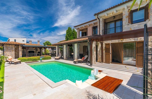 Casa de vacaciones SEASCAPE I con piscina climatizada y amplio jardín