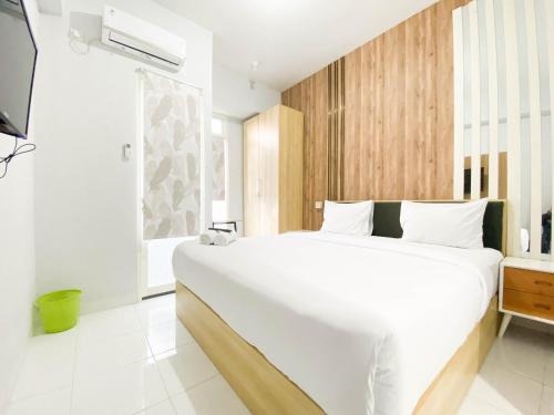 Homey 1BR without Living Room at Amartha View Apartment By Travelio