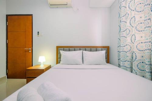 Homey and Comfortable 1BR Apartment at Royal Olive Residence By Travelio