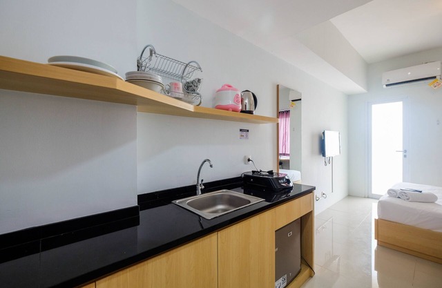 Homey and Comfy Studio Tamansari Mahogany Apartment