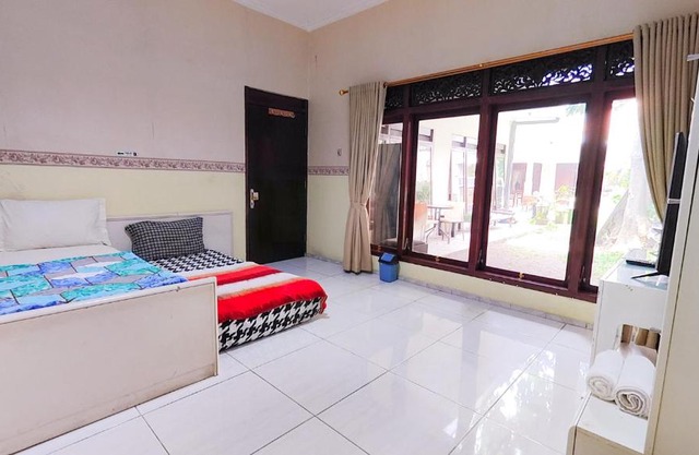 Homey Guesthouse near Sby Zoo Syariah