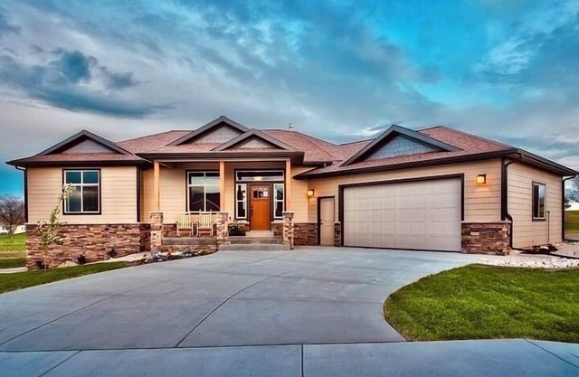 Entertainer’s dream! Custom home with large patio overlooking the golf course.