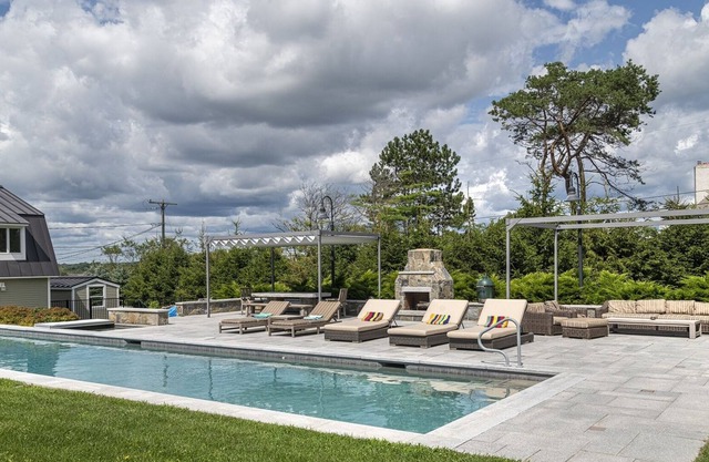 Hot tub, heated pool, spacious lawn, beach access and incredible ocean views.