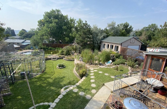 Hot tub. Ponds and waterfall and gardens. Sunroom/Man cave.