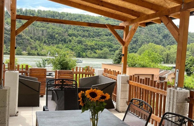 House on the Rhine with mountain views