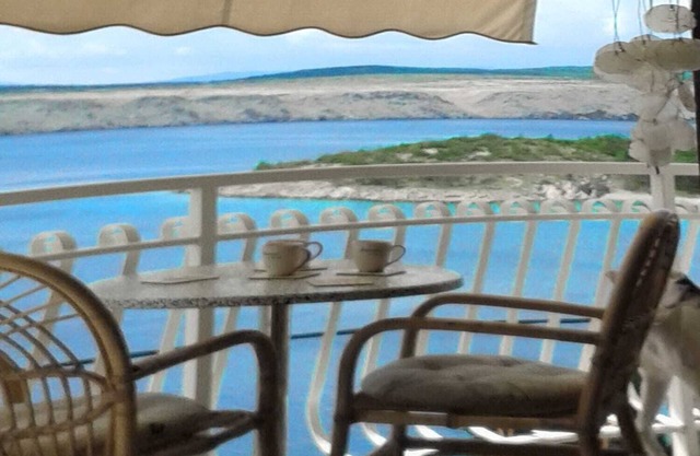 House with sea view above the beach