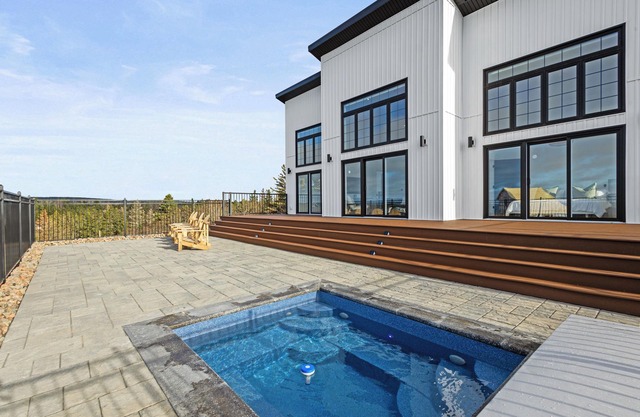 In ground HOT TUB + 2 primary bedrooms w/ ensuites