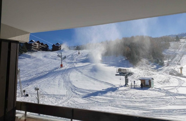 In the sun at the foot of the slopes!