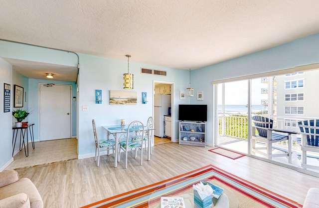 Inviting condo with ocean view, balcony, full kitchen, central AC, & W/D