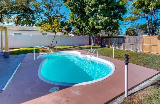Inviting, Dog Friendly home featuring pool and an excellent central location.