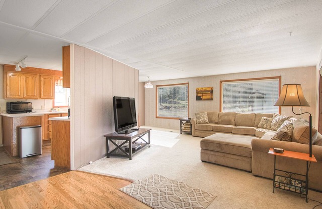 Inviting lakefront home with dock, fireplace, mountain view, & W/D