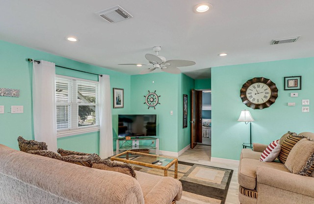 Inviting waterfront home with balcony, full kitchen, W/D, & dog-friendly