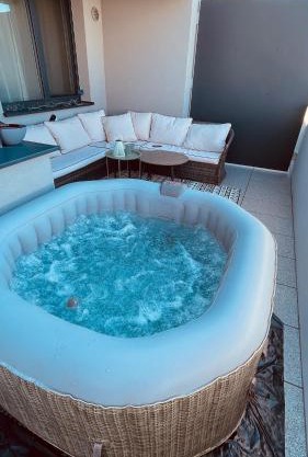 Jacuzzi area with sunset, terrace, free parking