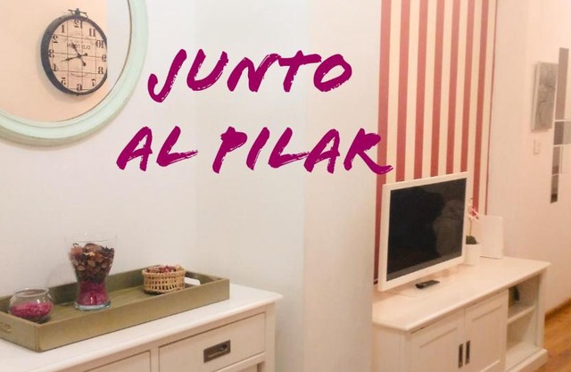 JUNTO AL PILAR