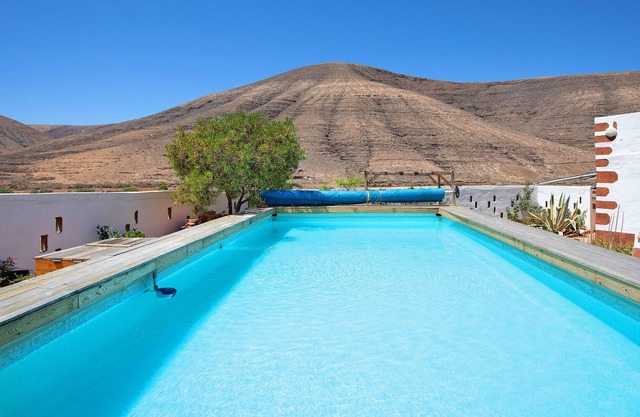 Casa de vacaciones Kikiki House Apartamento Rosso con vistas a la montaña, piscina y Wi-Fi