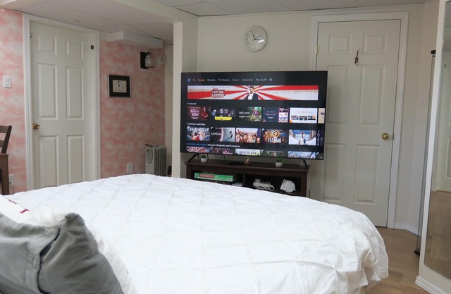 King bed private suite with 65'' 4K television