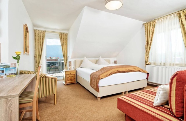 Komfortzimmer mit Seeblick - Hotel-pension Melcher