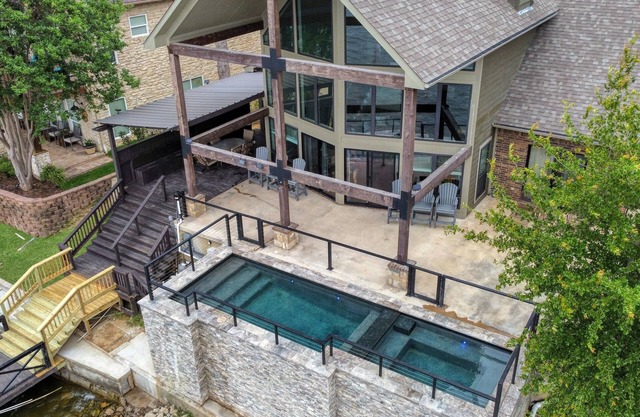 Lake House with pool + hot tub on Golf Course with boat dock