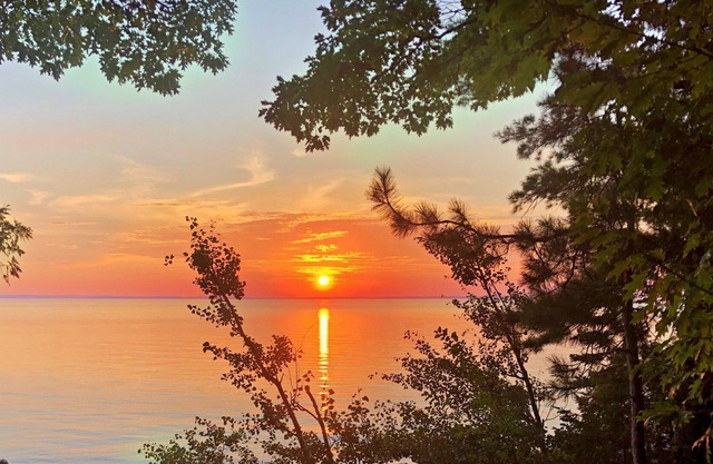 Lake Michigan Sunsets and sandy beachfront home on Grand Traverse Bay