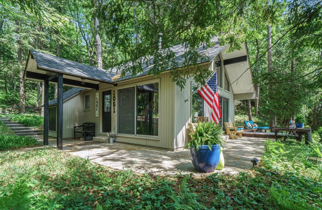 Dog-friendly cabin with lake views, a patio, and a wood-burning stove