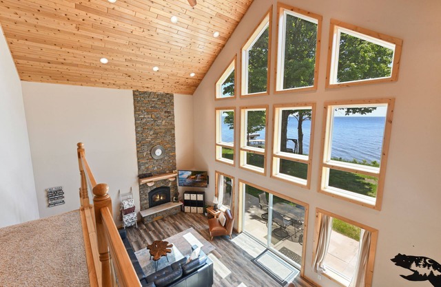Lakefront cabin with wall of windows and game room!