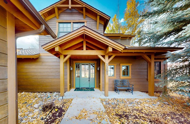 Lakefront home with a private dock, balcony, grill, gas fireplace, W/D, and AC