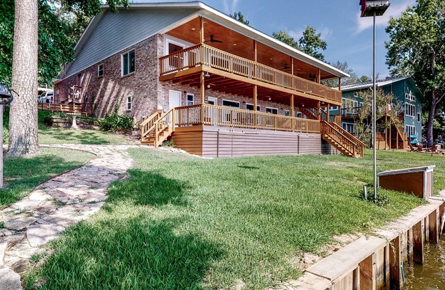Lakefront Life | House in Onalaska with fireplace, balcony, central AC, & W/D