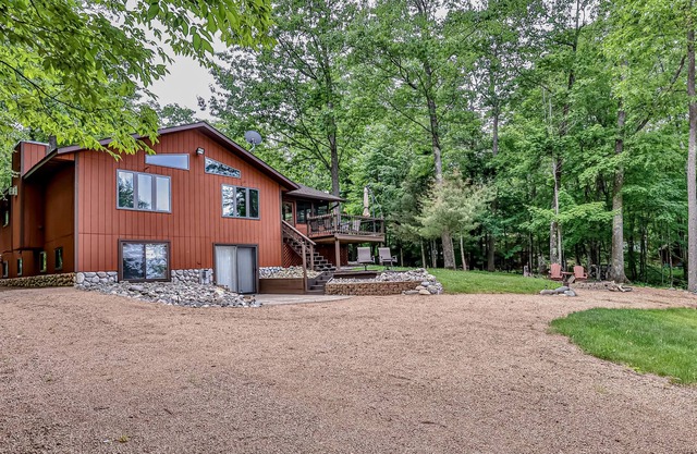 Lakefront paradise with a private beach, dock, firepits, washer/dryer, & AC