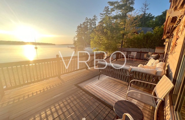 Lakehouse in Gilford sits on 100’ private beach and includes dock slip!