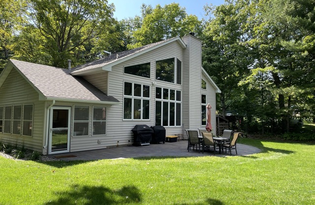 Lakeside home on one acre with private beach 90 minutes from the Twin Cities