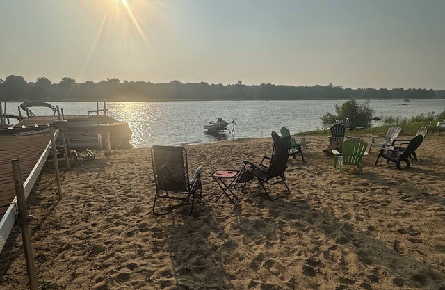 Lakeside Sunsets at this 3-bedroom lake cottage that sleeps 12 on Secord Lake.