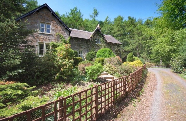 Large country house with outdoor hot tub and BBQ house and lovely gardens.