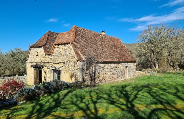 Large traditional stone house in peaceful countryside