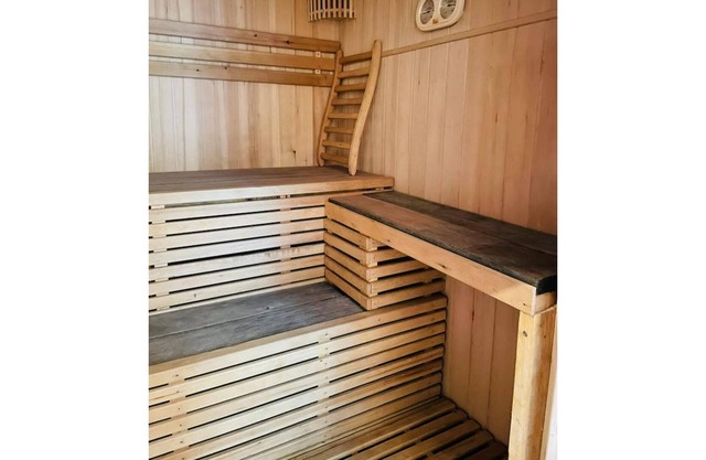 Le Lys holiday home, private courtyard and sauna.