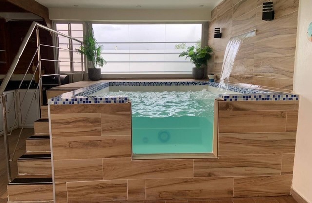 Liana’s rooftop entire apartment with private jacuzzi just 8 min near the beach.