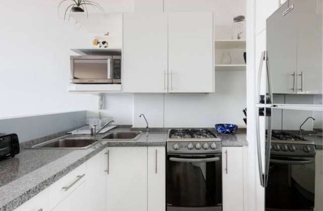 Loft in fifth floor with great views to green and the city and a roof garden too