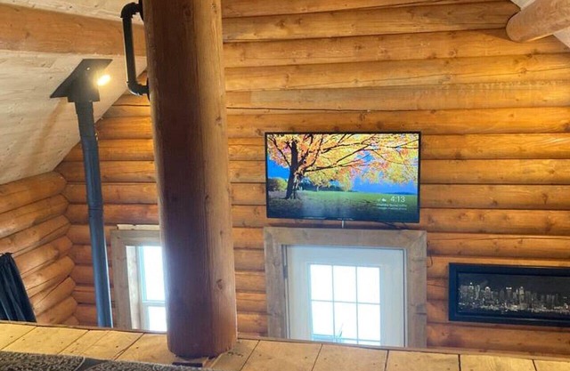 Lofted log cabin with fire table