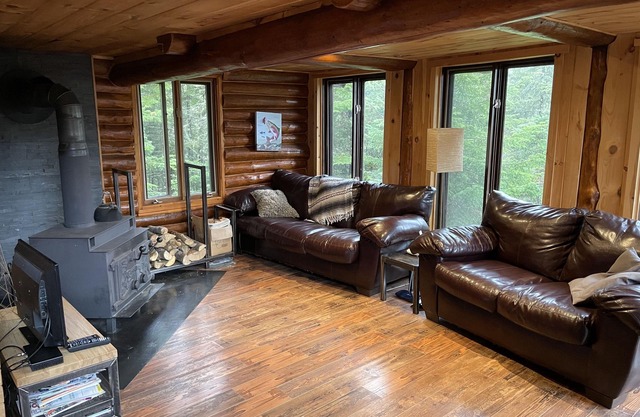 Log cabin in forest in Saint-michel-des-saints