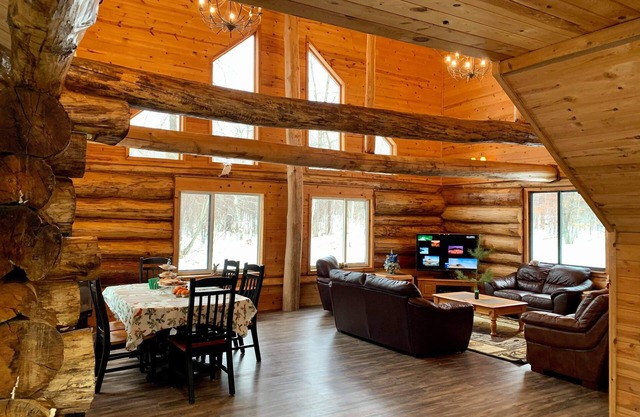 Log home surrounded by woods near Upper South Long Lake