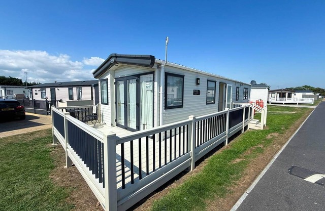 Lovely caravan with decking at Suffolk Sands Holiday Park ref 45017B