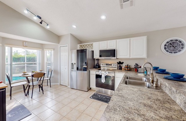 Lovely home with a heated pool, open-concept interior, central AC, and W/D
