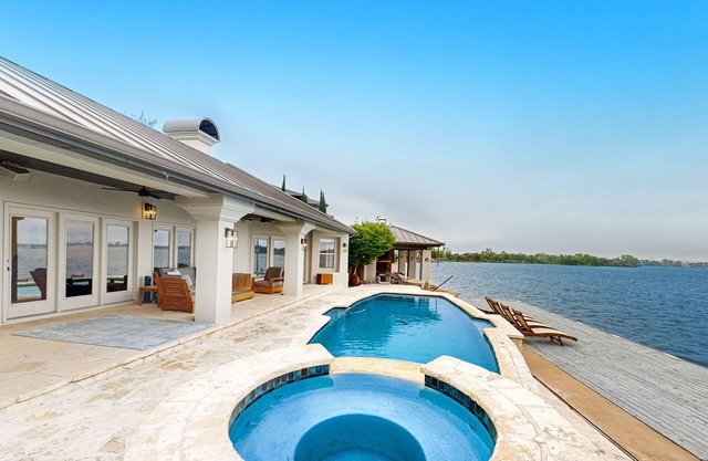 Luxe lakefront retreat with private pool, spa, lakeside terrace, gourmet kitchen