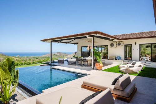 Luxe Tropical Villa with Sparkling Infinity Pool, Panoramic Ocean Views & Community Amenities