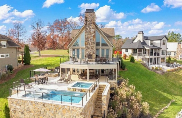 Luxurious Lakefront Home with a Private Saltwater Pool, Spa, & Deep-Water Dock
