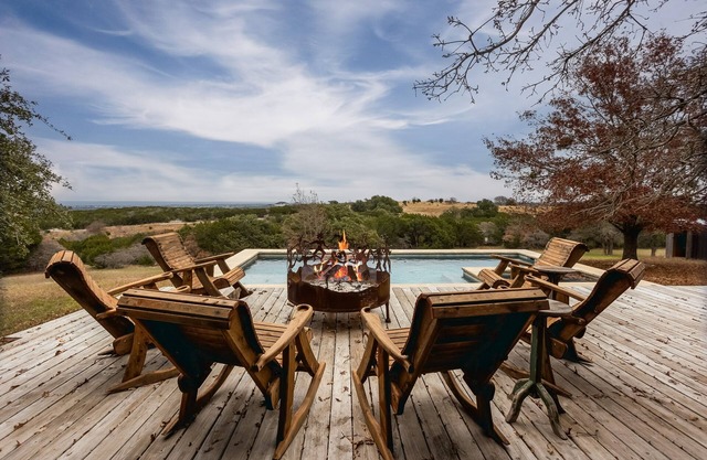Luxurious property with pool, hot tub, wraparound porch, & two primary suites