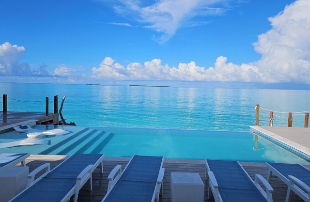 "Luxury beachfront paradise with incredible blue vistas!