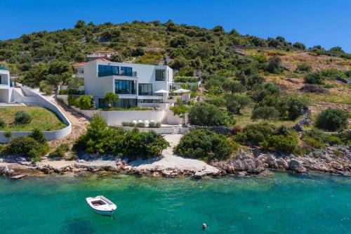 Luxury Seafront Villa Roots with private, heated pool, 5 en-suite bedrooms, enchanting sea views