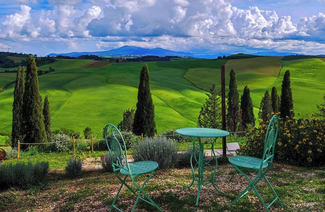 Mascagni farmhouse among the olive trees and the Tuscan hills in the Val d'Orcia