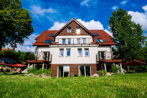 Mazurskie Apartamenty "Jak Tu Miło!"
